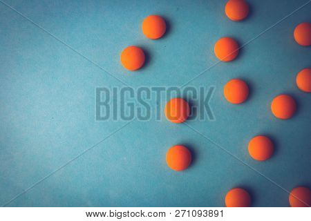 Small Yellow Orange Beautiful Medical Pharmaceptic Round Pills, Vitamins, Drugs, Antibiotics On A Bl