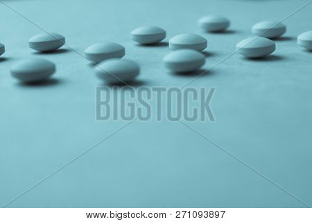Small Yellow Orange Beautiful Medical Pharmaceptic Round Pills, Vitamins, Drugs, Antibiotics On A Bl