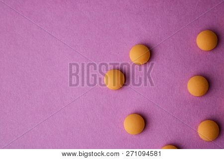 Small Yellow Orange Beautiful Medical Pharmaceptic Round Pills, Vitamins, Drugs, Antibiotics On A Pi