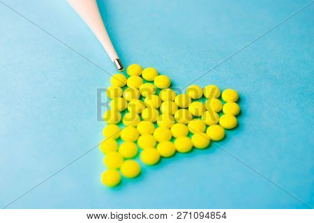 Small Medical Pharmaceptic Round Pills, Vitamins, Drugs In The Form Of A Heart And Electronic Thermo