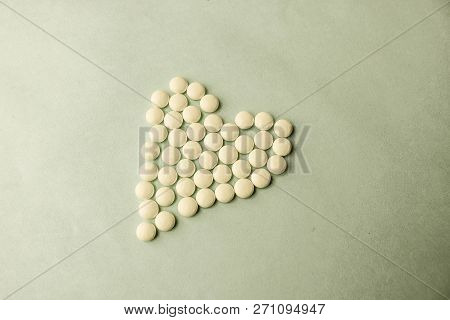 Small Medical Pharmaceptic Round Pills, Vitamins, Drugs, Antibiotics In The Form Of A Heart On A Bla