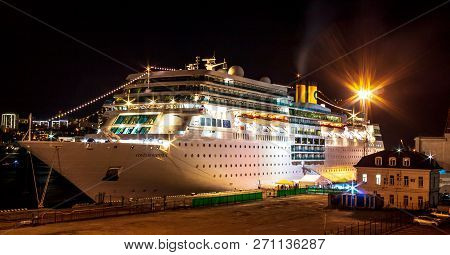 Ocean Liner Costa Romantica Moored At Night On The Pier In The Downtown Of The Far Eastern City Of V