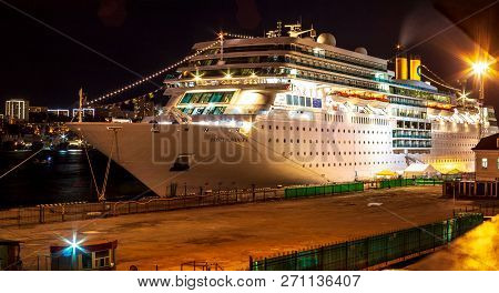 Ocean Liner Costa Romantica Moored At Night On The Pier In The Downtown Of The Far Eastern City Of V