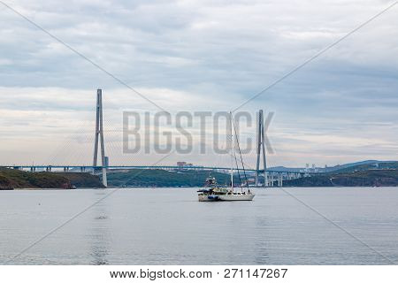 Sailboat During The International Sailing Regatta Against The Background Of The Russian Bridge To Th