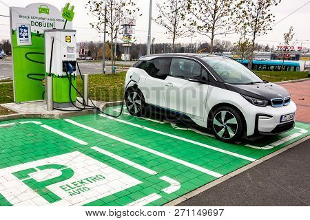 Ostrava, Czech Republic - November 27, 2018: Bmw I3 Electric Car Is Charged On A Green Parking Space