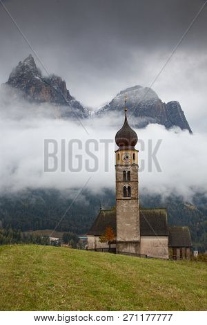 san Valentino church on a foggy late autumn day, Siusi allo Sciliar, Castelrotto, Dolomites, Italy