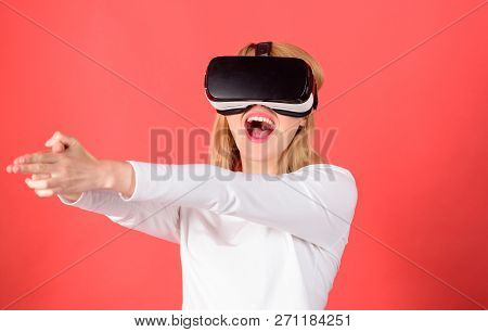 Woman Using Virtual Reality Headset. Happy Young Woman Wearing Virtual Reality Goggles Watching Movi
