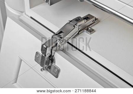 Metal Hinges For A Cupboard. Close Up