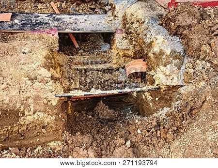 Crossection Of Metallic And Fiber Optic Cables With Potable Water Tap Threads.  Mechanized Excavatio