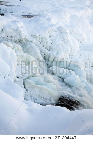 frozen waterfall Tannforsen in winter, Sweden