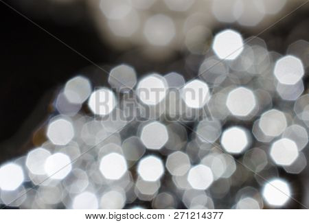 Blurred Background. Lots Of Glowing White Spots Of Heptagons. Abstract Background.