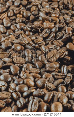 Background:a Lot Of Coffee Whole Grains Lies. Vertical Toned Photography