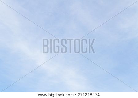 Blue Sky With White Porous Clouds In Summer