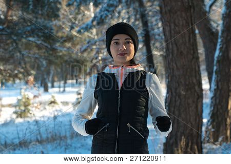 Running Winter Snow Running Girl Runs Through The Woods In Winter Sport Winter. Healthy Lifestyle