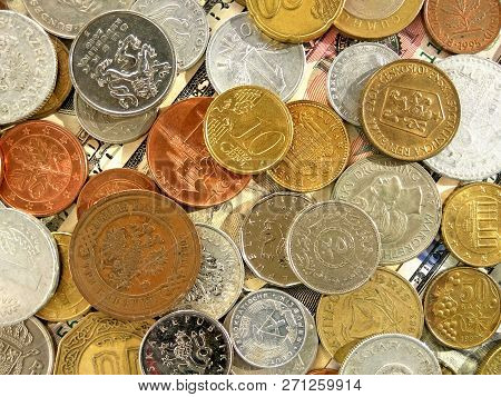 Close up top view image of large amount of old money coins of different countries and times on dolla