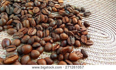 Roasted Brown Coffee Beans On Cloth Background
