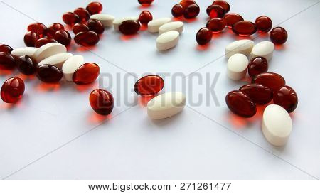Assorted colorful pharmaceutical medicine pills, tablets and capsules on white background. Pharmacy