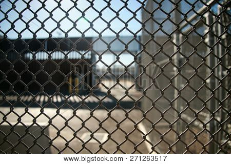 San Ysidro, California - 11/26/2018: Border fence between the USA and Mexico including New Construction adding an additional layer of fencing and razor wire or barbed wire to secure the border.