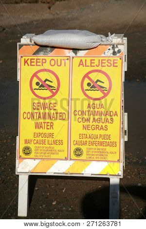 San Ysidro, California - 11/26/2018: Signs seen at the US/Mexico border. Warning, Do not cross, Directional and Location signs at the border between the USA and Mexico. Close to San Diego California.