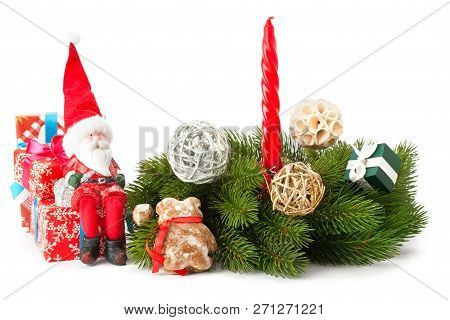 Composition Of The Christmas Decoration. Bright Ornaments,spuce Branches,santa And Gifts Isolated On