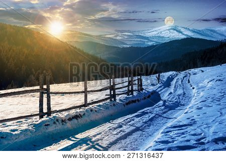 Time Change Concept. Country Road In To The Winter Mountains. Wooden Fence Along The Road. Composite