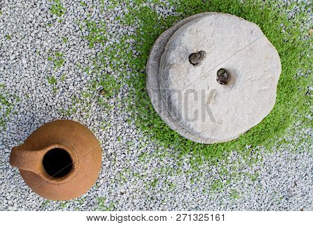 Traditional Greek And Cypriot Stone Mill And Clay Pot Top View