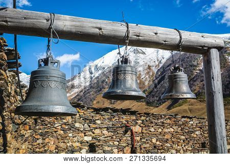 Bells In Lamaria Church In Zhibiani - Ushguli Community Of Villages, Upper Svaneti, Georgia. Snow Co