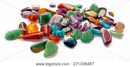 Assorted Natural Bright Coloured Semi Precious Gemstones And Gems On White Background