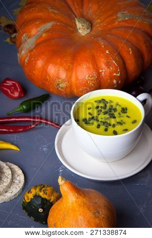 Pumpkin Asian Coconat Cream Soup. Autumn Hot Food. Chili Pepper, Garlic, Red Onion, Big Pumpkin. Dar