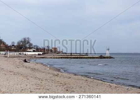 Klampenborg, Denmark - March 25, 2017:  People At One Of The Iconic Lifeguard Towers At Bellevue Bea