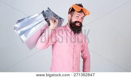 Man Bearded Hipster Wear Sunglasses Hold Bunch Shopping Bags. How To Get Ready For Your Next Vacatio