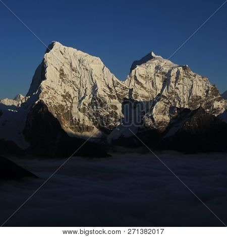 View From Gokyo Ri, Everest National Park. Snow Covered Mountains Cholatse And Taboche.