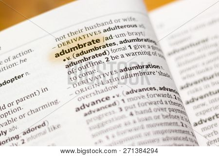 The Word Or Phrase Adumbrate In A Dictionary Highlighted With Marker.