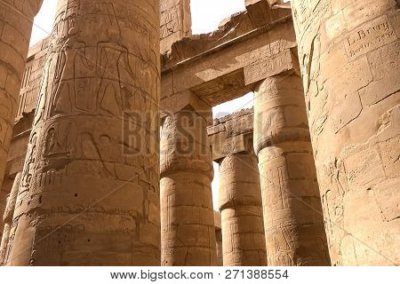Egyptian Hieroglyphs And Drawings On The Walls And Columns. Egyptian Language, The Life Of Ancient G