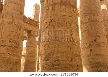 Egyptian Hieroglyphs And Drawings On The Walls And Columns. Egyptian Language, The Life Of Ancient G