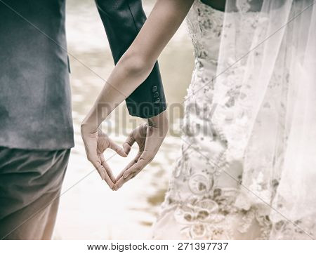 The Abstract Artdesign Background Of Wedding Couple Is Making Love Hand Sign Together,heart Sign Wit