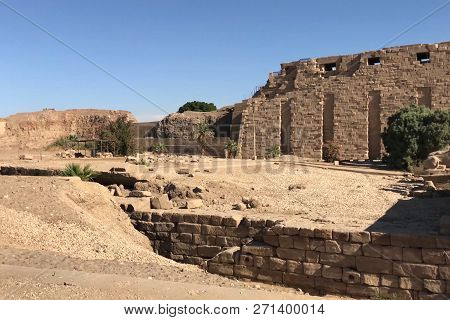 Buildings And Columns Of Ancient Egyptian Megaliths. Ancient Ruins Of Egyptian Buildings