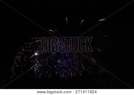 The Celebration Colored Firework Flashing In The Black Night Sky