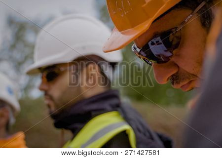 Moscow, Russia - May 22, 2018: Workers In Helmets On The Construction Site. Construction Works