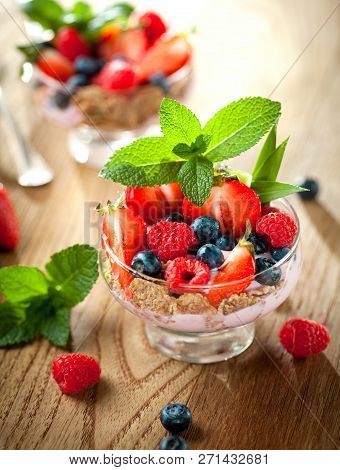 Summer Dessert With Strawberries On A Wooden Background.