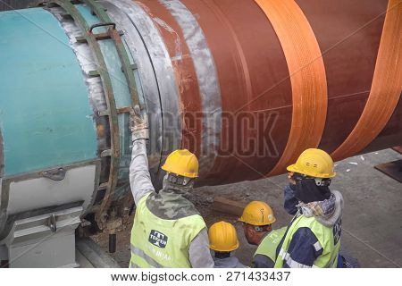 Moscow, Russia - May 22, 2018: Workers In Helmets On The Construction Site. Construction Work On The