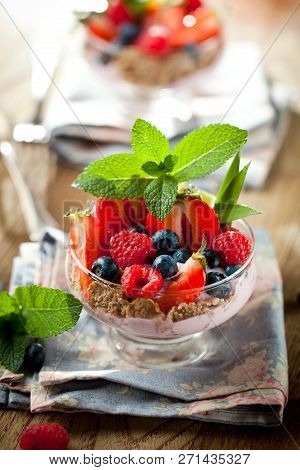 Summer Dessert With Strawberries On A Wooden Background.