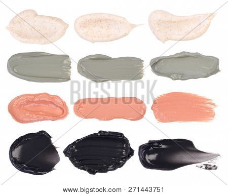 Cosmetic masks smears. Moisturizing, peeling, clay and charcoal masks isolated on a white background.