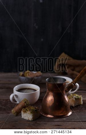 Traditional Turkish Coffee And Turkish Delight On Dark Wooden Backgroundm Copy Space