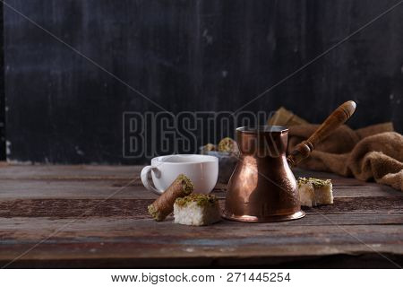 Traditional Turkish Coffee And Turkish Delight On Dark Wooden Backgroundm Copy Space