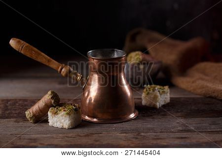Traditional Turkish Coffee And Turkish Delight On Dark Wooden Backgroundm Copy Space