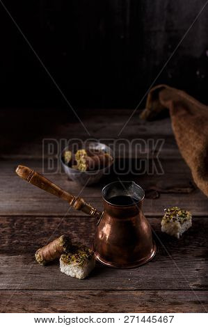 Traditional Turkish Coffee And Turkish Delight On Dark Wooden Backgroundm Copy Space