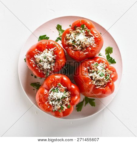 Baked Red Bell Pepper Filled With Minced Meat, Rice, Parmesan Cheese On White Stone Background. Top 