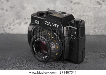 Moscow, Russia, November 29, 2018. The Old Soviet 35 Mm Slr Camera Zenit 122, Released 1997, On A Gr