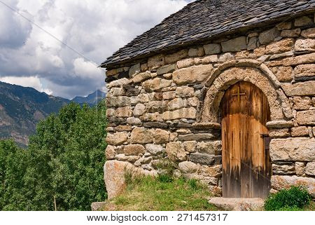 Old Romanesque Wooden Cross And Door Of The Sant Quirc De Taull Hermitage, Catalonia, Spain.